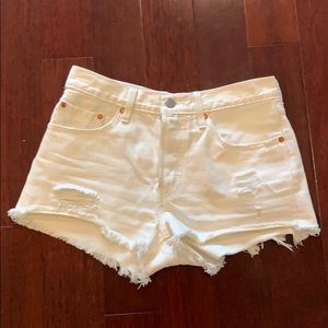 Levi’s 501 white distressed jean shorts